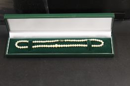 A CULTURED PEARL NECKLACE WITH 9CT GOLD FASTENER