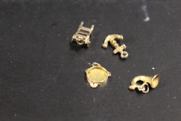 FOUR 9CT GOLD CHARMS