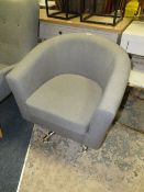 A MODERN UPHOLSTERED GREY COLOURED SWIVEL ARMCHAIR