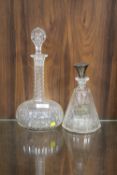 A HALLMARKED SILVER TOPPED DECANTER TOGETHER WITH ANOTHER DECANTER (2)
