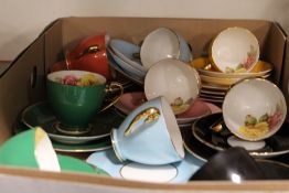 A TRAY OF ASSORTED EDWARDIAN BONE CHINA HARLEQUIN COLOURED FLORAL CUPS, SAUCERS ETC