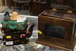 A NOVELTY CERAMIC TEAPOT TOGETHER WITH A NOVELTY PHOTOGRAPH ALBUM BOX (2)