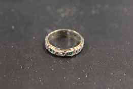 A VINTAGE 9CT GOLD AND SILVER ETERNITY RING