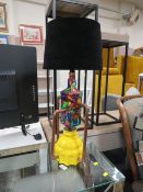 AN UNUSUAL GLASS AND COPPER LAMP