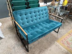 A SMALL MODERN TEAL SETTEE WITH METAL BASE W-119 CM