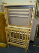 A PAIR OF MODERN 'FEATHER & BLACK' OAK SINGLE BED FRAMES