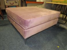 A LARGE SQUARE UPHOLSTERED STOOL WITH CHROMED FEET 100 X 100 CM