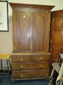 A SMALL 19TH CENTURY PINE HOUSEKEEPERS CUPBOARD WITH PAINTED DETAIL TO THE DOORS H-208 W-107 CM