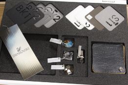 TWO CASED SWAROVSKI AND SCHONBEK DISPLAY STANDS / ENGRAVING SET