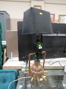 AN UNUSUAL GLASS/WOODEN AND COPPER LAMP