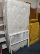 A MODERN METAL SINGLE BED FRAME WITH MATTRESS