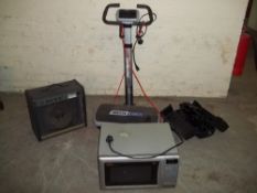 A VIBRATOR MACHINE, A MUSIC AMP BY TRAMP A BELLING MICROWAVE AND A TRINICON MOVIE CAMERA