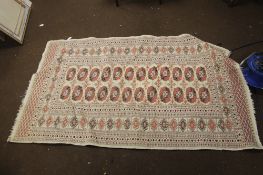 AN ANTIQUE WOOLEN RUG