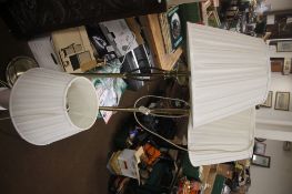TWO BRASS STANDARD LAMPS AND A PORCELAIN TABLE LAMP ALL WITH SHADES