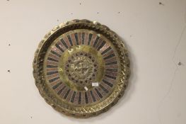 A LARGE BRASS CHARGER 60CM DIAMETER