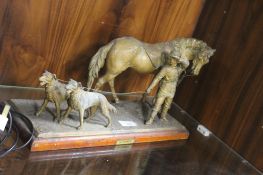 A METAL GROUP OF FIGURES ON A WOODEN BASE ENTITLED LA POURSUITE