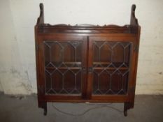 AN OAK OLD CHARM LEADED WALL DISPLAY CABINET