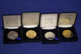 FOUR CASED MEDALLIONS