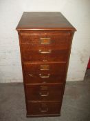 AN OAK FILING CABINET