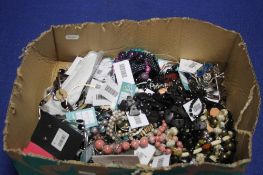 A BOX OF COSTUME JEWELLERY