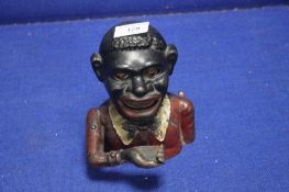 A VINTAGE CAST IRON MONEY BOX