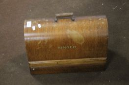 A VINTAGE SEWING MACHINE IN WOODEN CASE