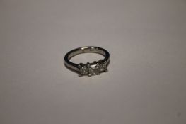 A LADIES PLATINUM 3 STONE PRINCESS CUT DIAMOND RING