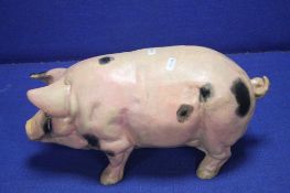 AN UNUSUAL CAST FIGURE OF A PIG