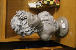 A REPRODUCTION CAST BUST OF A PRETTY LADY