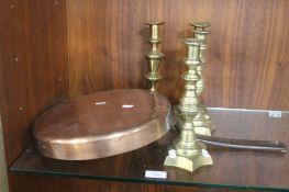 AN ANTIQUE COPPER FRYING PAN AND 2 PAIRS OF CANDLE STICKS