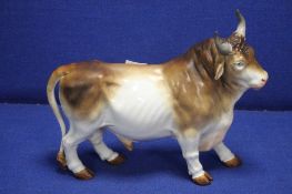 A 19TH CENTURY PORCELAIN MODEL OF A BULL, WITH BLUE CROSSED SWORDS MARK, POSSIBILY MEISSEN L 36 CM