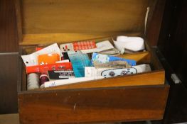 A VINTAGE WOODEN SEWING BOX AND CONTENTS