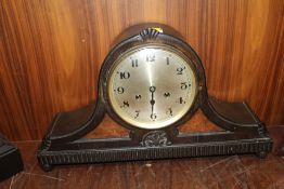 AN OAK AND WALNUT CASED GONG STRIKE MANTLE CLOCK