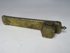 A VINTAGE BRASS ISLAMIC PEN CASE WITH INTEGRAL INKWELL, L 21 cm, W 3 cm