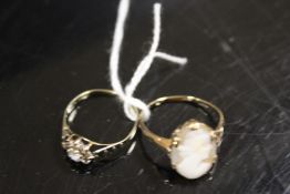 A HALLMARKED 9CT GOLD DRESS RING TOGETHER WITH AN UNMARKED CAMEO RING (2)