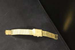 A TISSOT STYLIST QUARTZ WRISTWATCH WITH WHITE STONE SET HOUR MARKERS