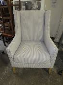 A LARGE MODERN STRIPED UPHOLSTERED ARMCHAIR
