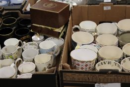 TWO TRAYS OF ASSORTED CERAMIC CUPS, MUGS ETC TO INCLUDE A SPODE LIMITED EDITION PRINCE WILLIAM OF