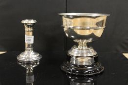 A HALLMARKED SILVER CANDLESTICK TOGETHER WITH A SMALL TROPHY BOWL ON STAND (2)