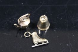 THREE 9CT GOLD CHARMS