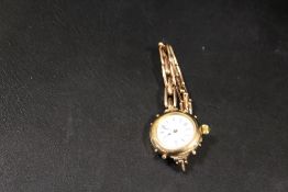 A YELLOW METAL LADIES WRISTWATCH ON EXPANDING BRACELET