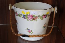 A LARGE CERAMIC WICKER HANDLED PAIL