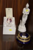 A BOXED ROYAL CROWN DERBY CERAMIC EGG WITH STAND, TOGETHER WITH A ROYAL DOULTON FIGURINE ETC (3)