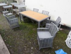A MODERN RECTANGULAR PATIO TABLE AND SIX CHAIRS