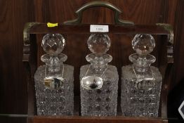 A THREE BOTTLE TANTALUS