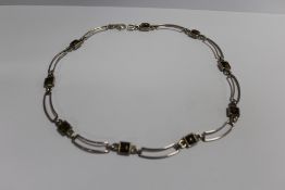 A VINTAGE SILVER AMBER NECKLACE