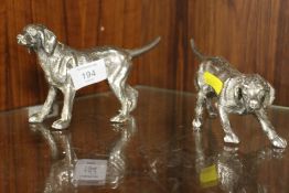 A PAIR OF DECORATIVE CAST METAL DOG FIGURES