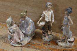 A NAO FIGURE OF TWO CHILDREN PLAYING TOGETHER WITH TWO CASADAS FIGURES (3)