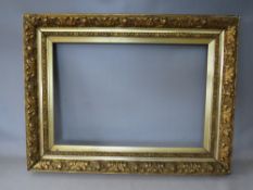 A 19TH CENTURY GOLD FRAME WITH LEAF DESIGN AND INTEGRAL GOLD SLIP, frame W 11 cm, rebate 65 x 45 cm