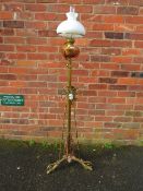 A VICTORIAN BRASS LAMP STANDARD WITH SHADE